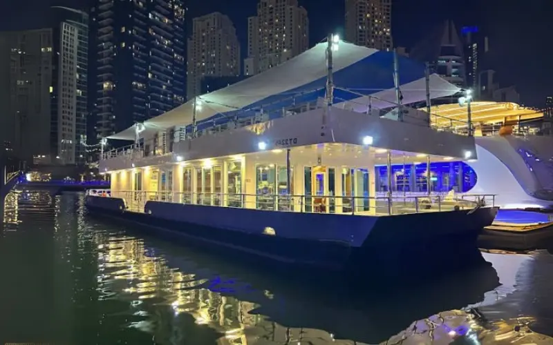 Five Star Sea Lounge Marina Deal Premium Dhow Cruise in Dubai Marina featuring buffet dinner, live Tanoura dance, welcome drink, unlimited soft drinks, and luxury dinner cruise experience.